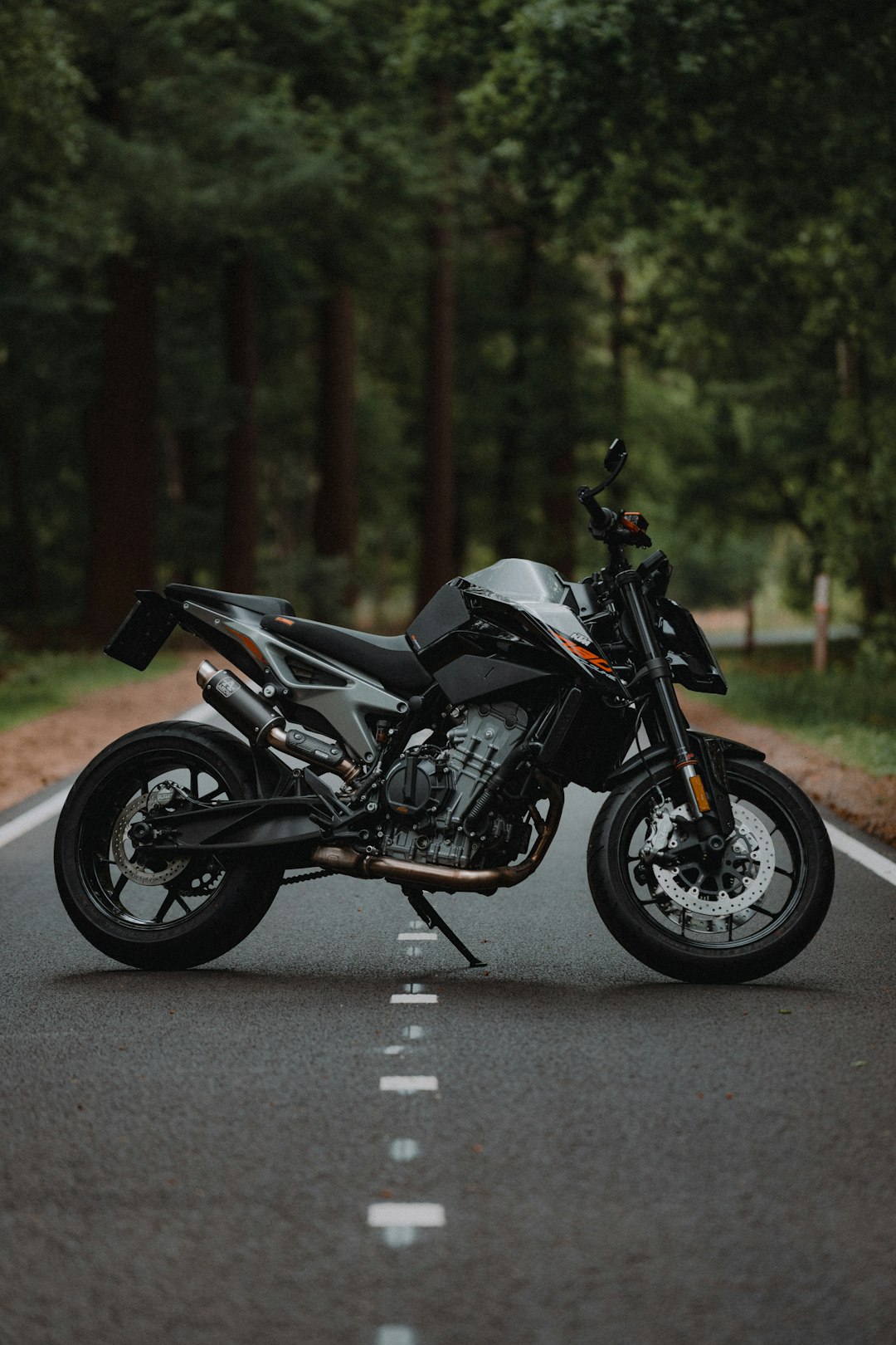 black-and-silver-naked-motorcycle-on-road-during-daytime-5rcxih1e44